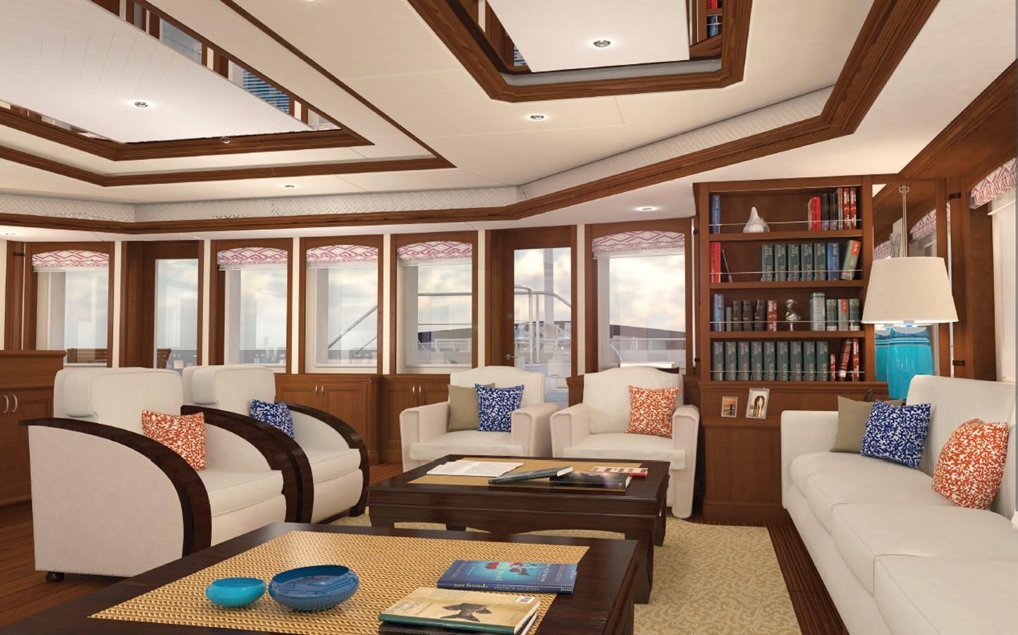 a living room with a table and couches aboard SIMON FRASER Yacht for Sale