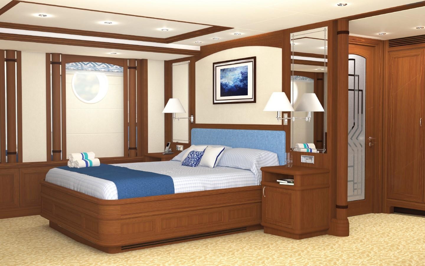 a bedroom with a bed and a mirror aboard SIMON FRASER Yacht for Sale