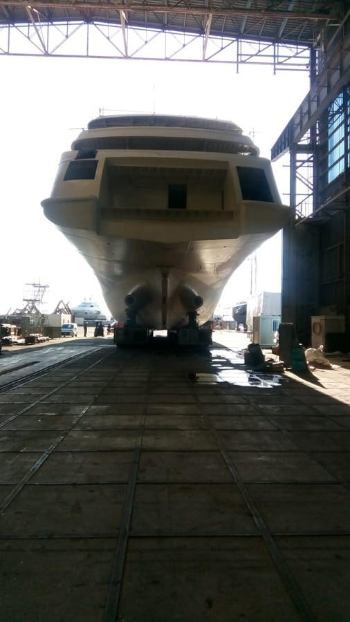 a large white airplane aboard SIMON FRASER Yacht for Sale