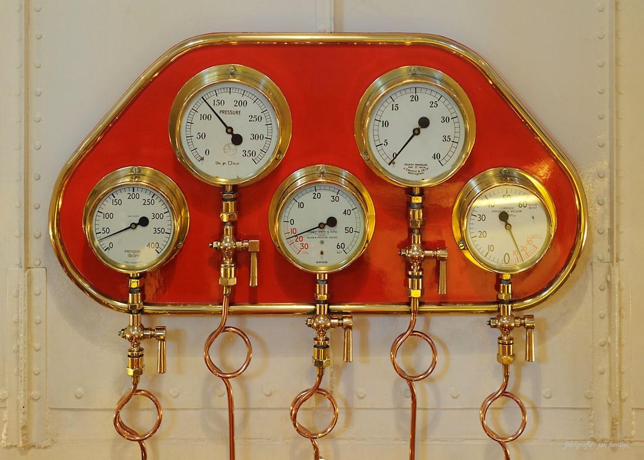 a clock with several clocks aboard MAJESTEIT Yacht for Sale