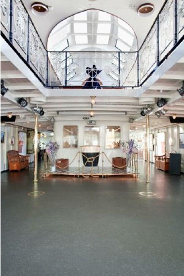 a large room with a chandelier and a chandelier aboard MAJESTEIT Yacht for Sale