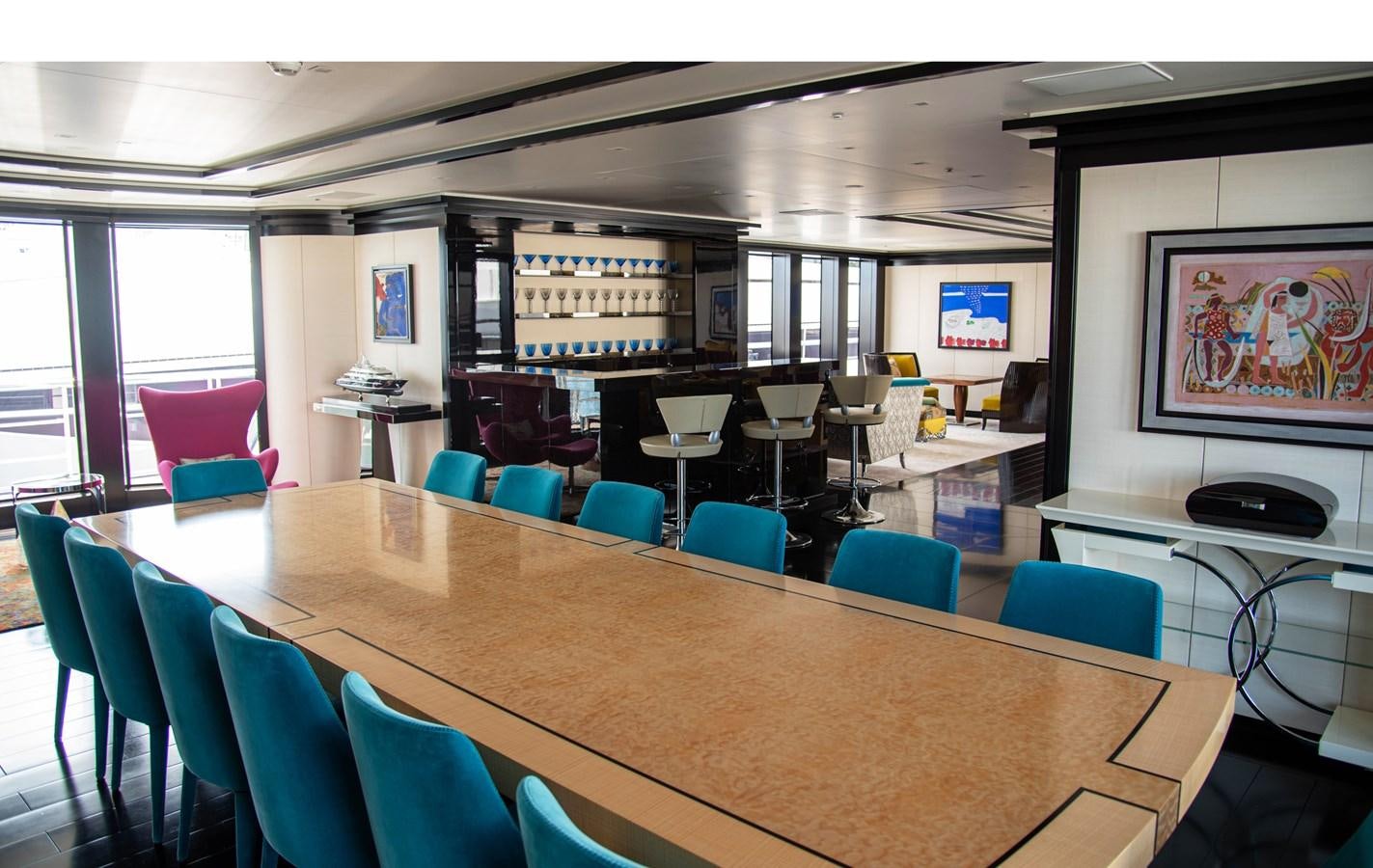 a conference room with tables and chairs aboard LADY VERA Yacht for Charter