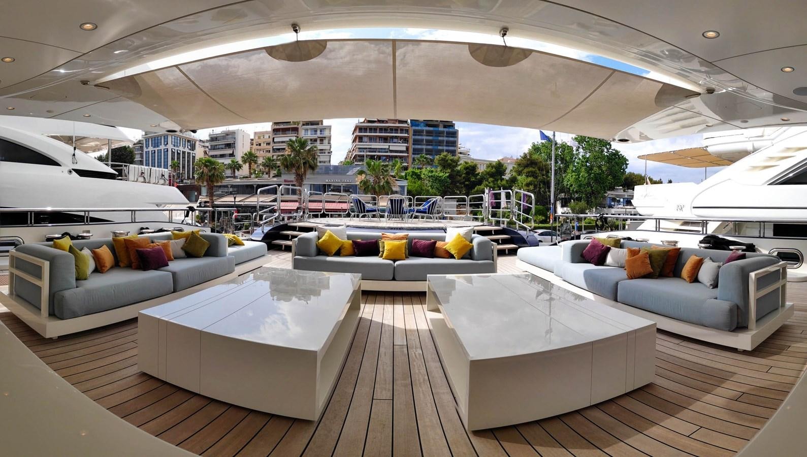 a living room with a large patio aboard LADY VERA Yacht for Sale