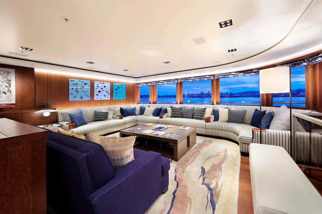 a living room with a couch and a table aboard PLANET NINE Yacht for Charter