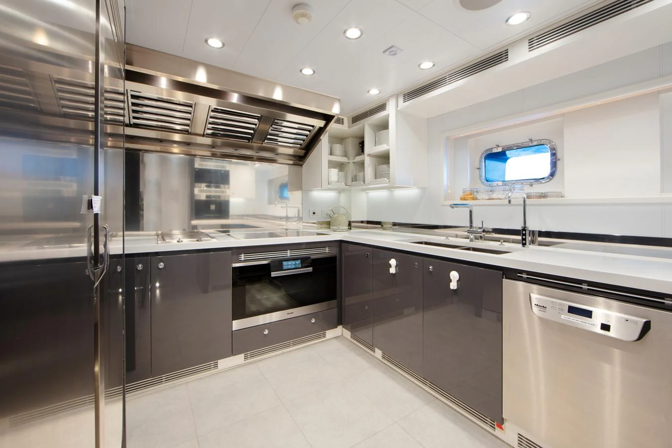 a large kitchen with stainless steel appliances aboard PLANET NINE Yacht for Charter