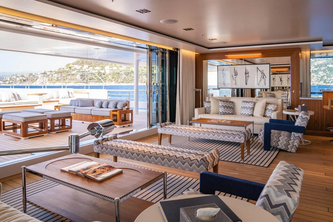 a living room with a large window aboard PLANET NINE Yacht for Charter