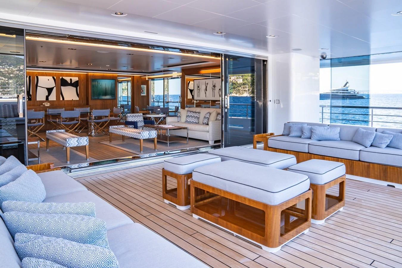 a living room with a large window aboard PLANET NINE Yacht for Charter