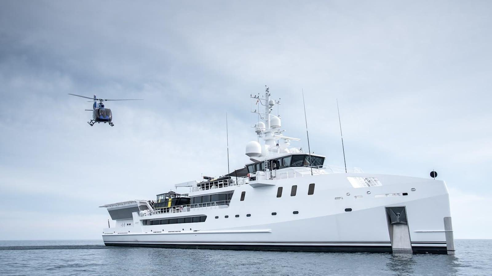 a helicopter flying over a ship aboard GAME CHANGER Yacht for Sale
