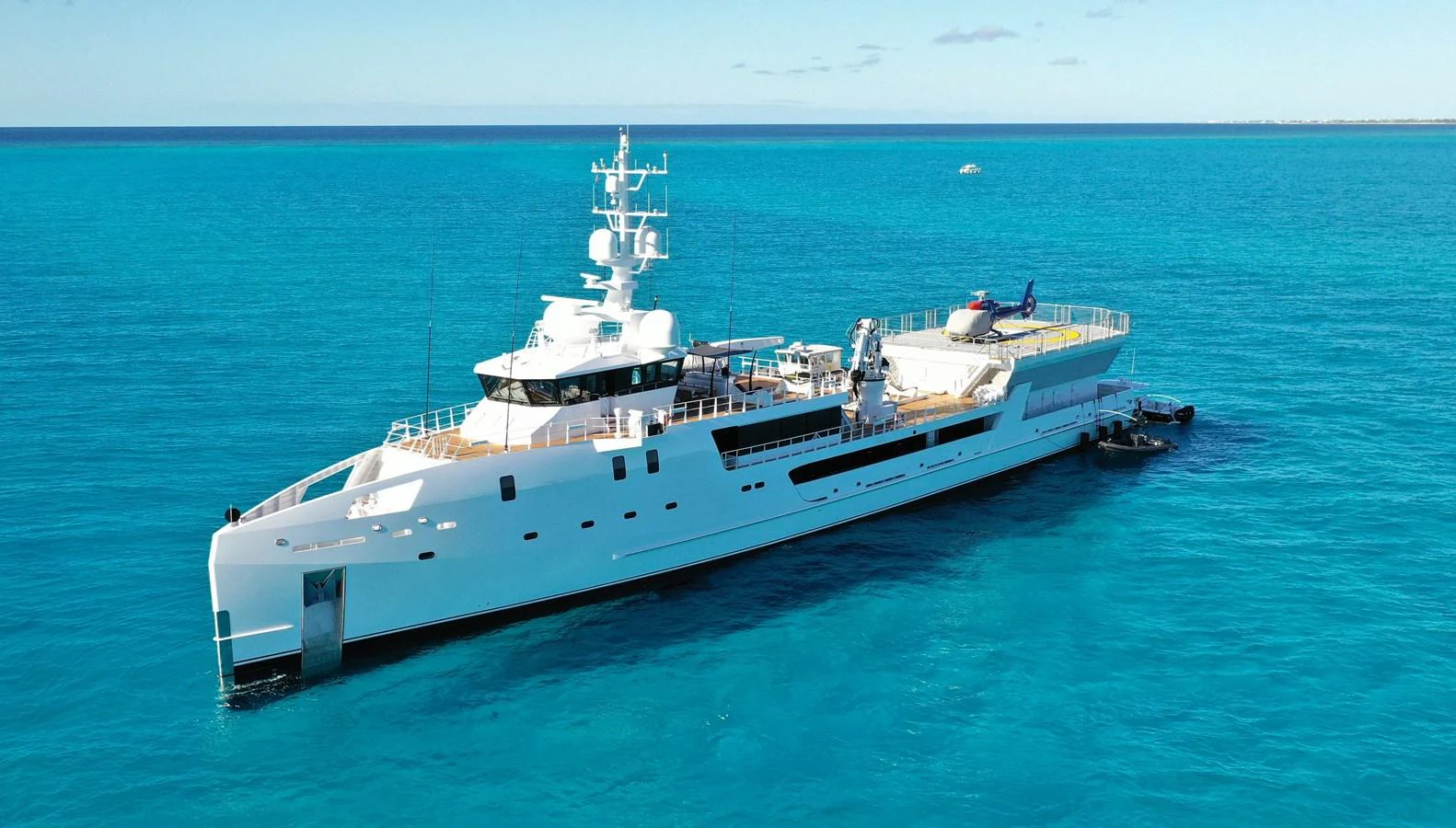 a large ship in the water aboard INDRATUS Yacht for Sale
