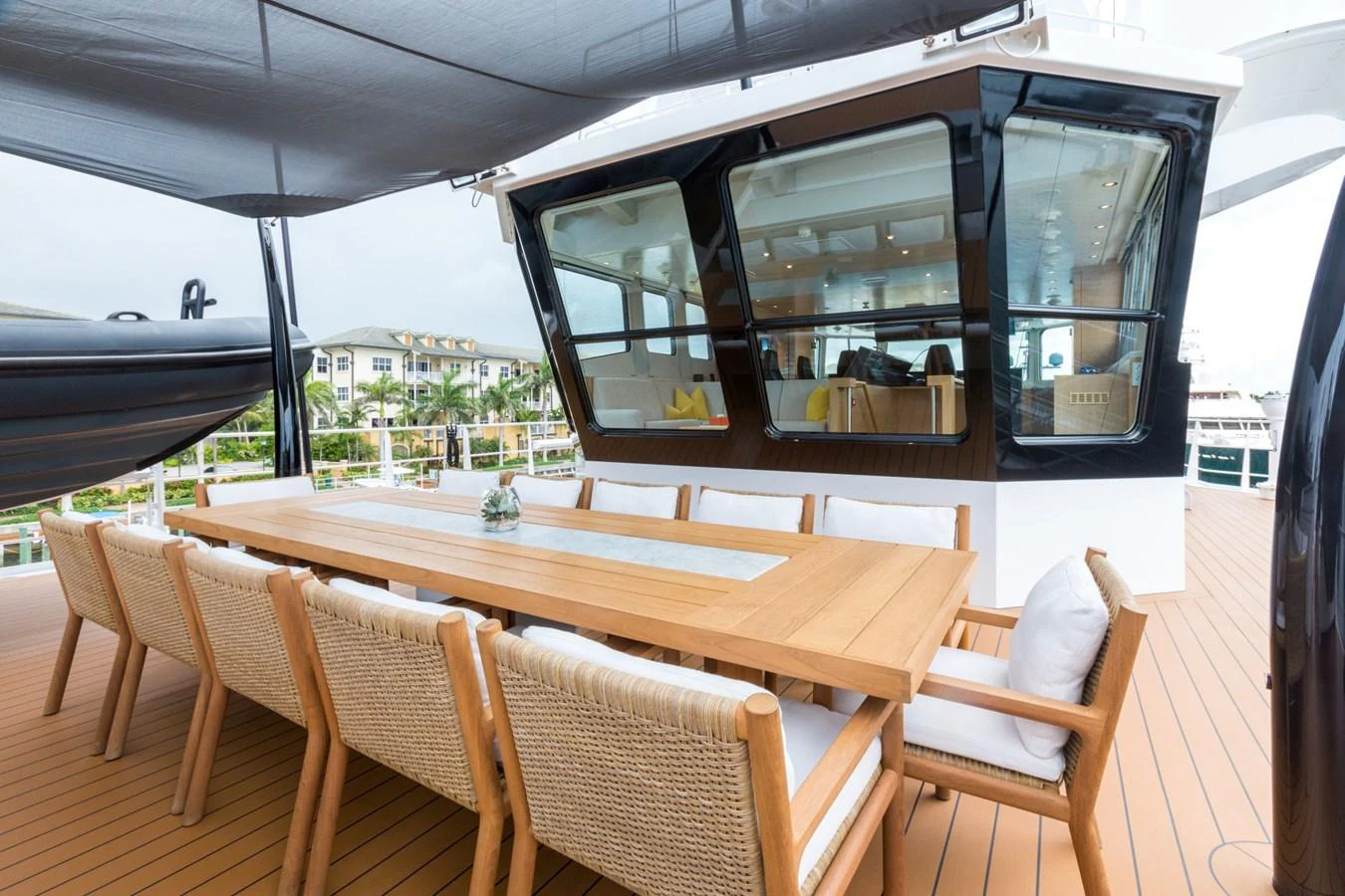 a table and chairs on a deck aboard INDRATUS Yacht for Sale
