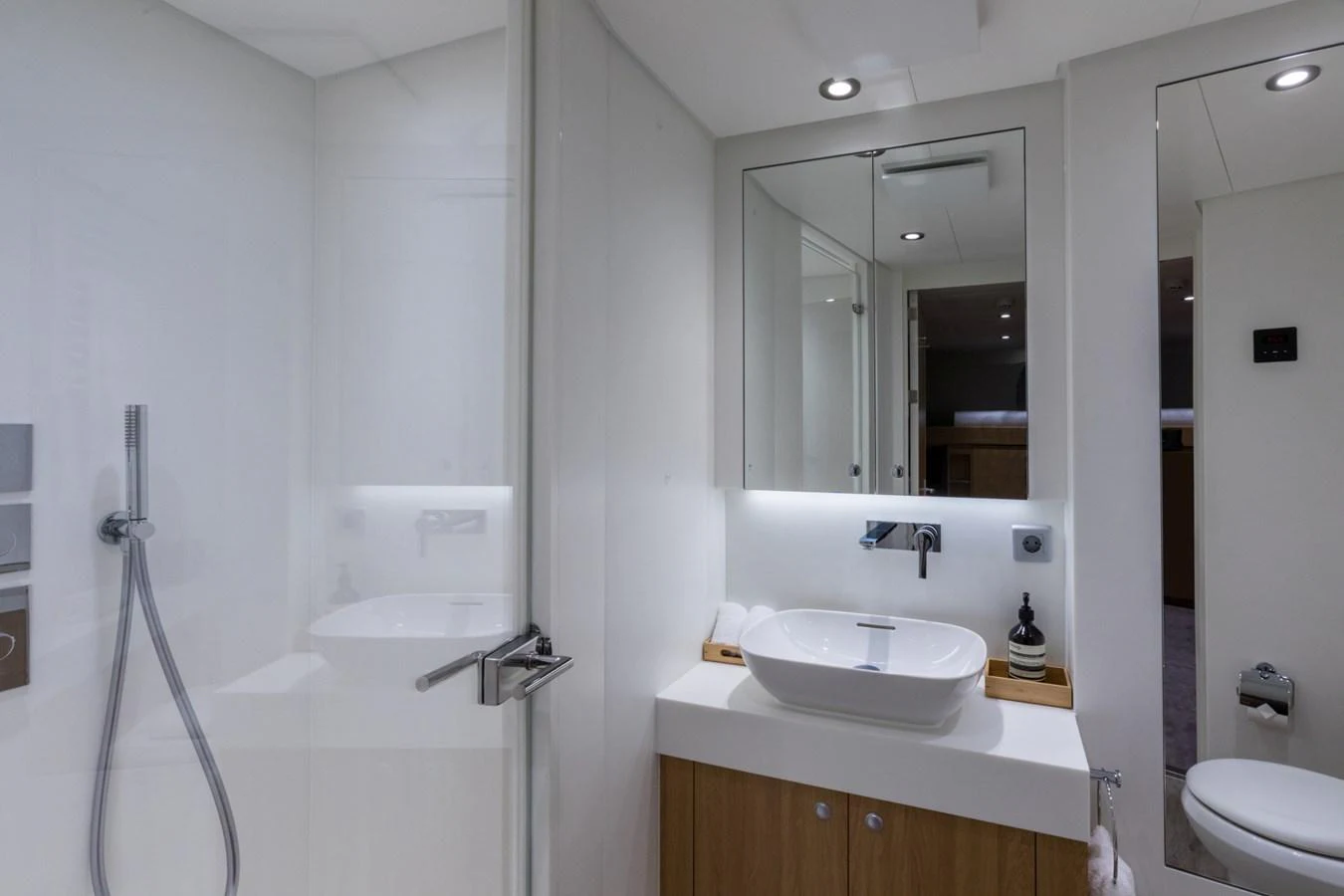 a bathroom with a sink and a mirror aboard INDRATUS Yacht for Sale