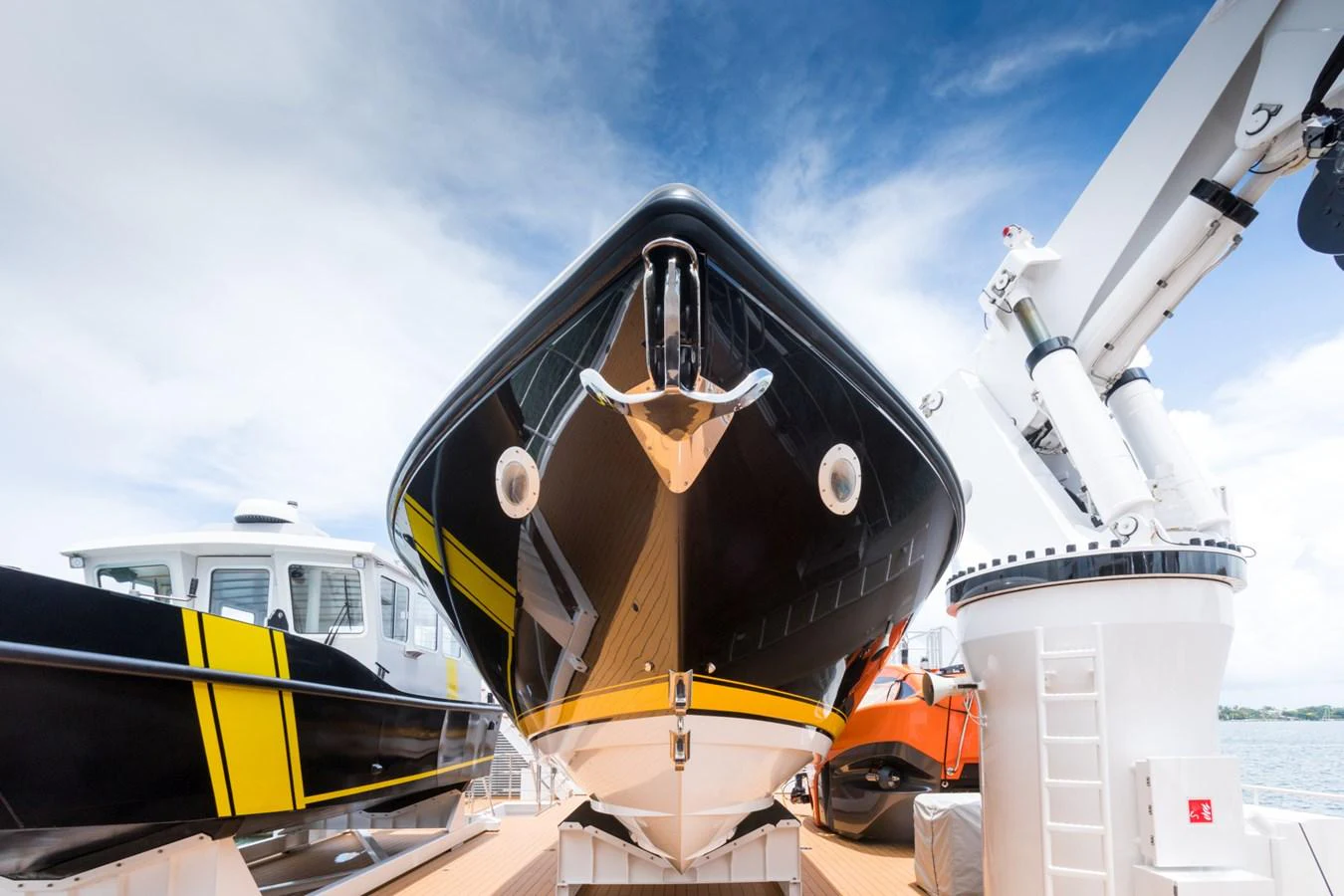 a helicopter with a large piece of equipment on the front aboard INDRATUS Yacht for Sale