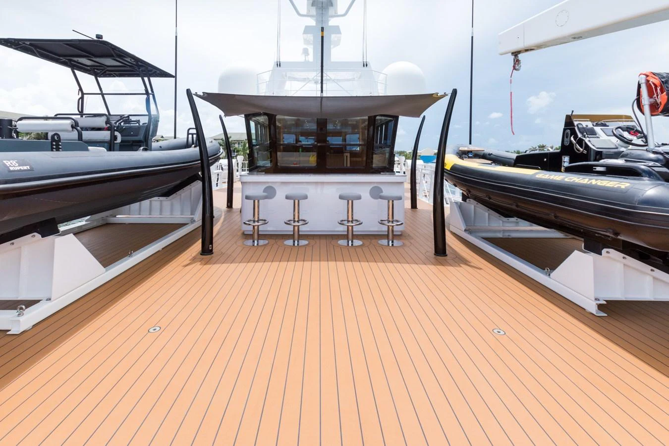 a room with a table and chairs aboard INDRATUS Yacht for Sale