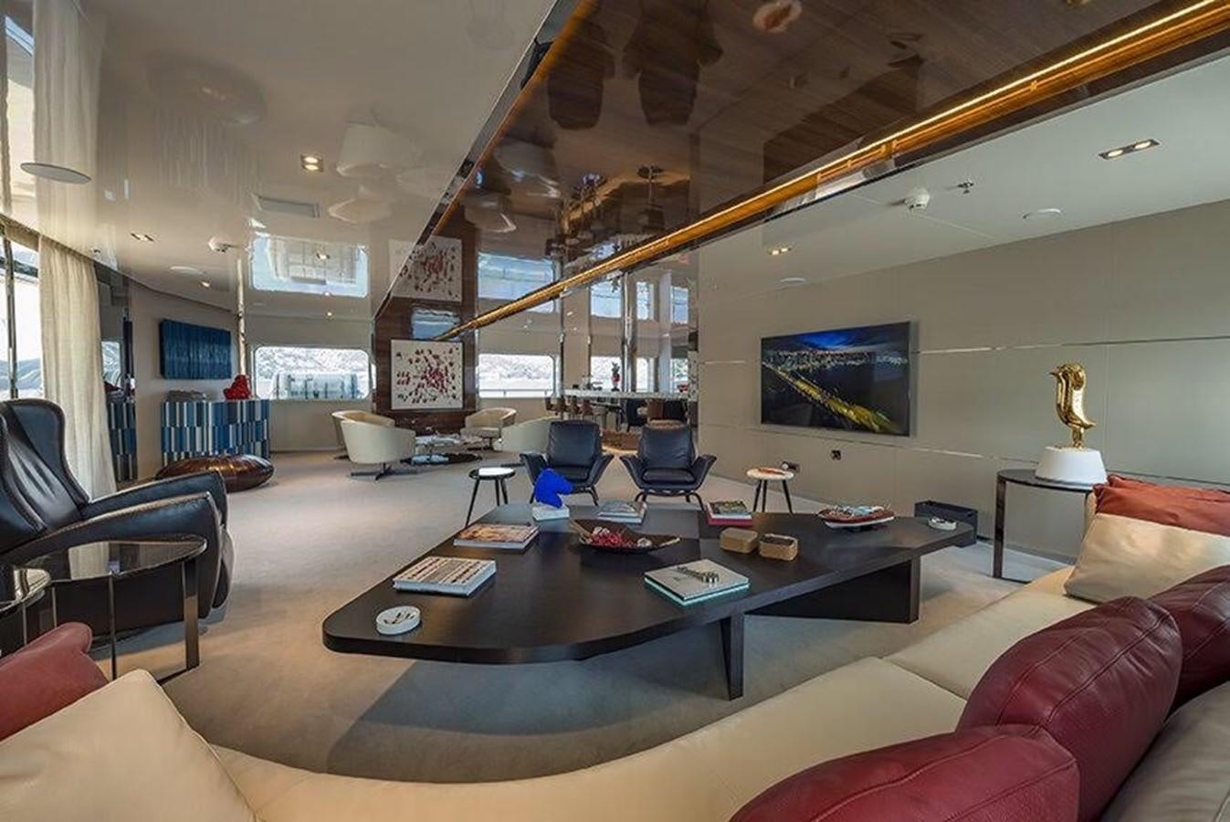 a large living room with a large table and chairs aboard MARQUISE Yacht for Sale