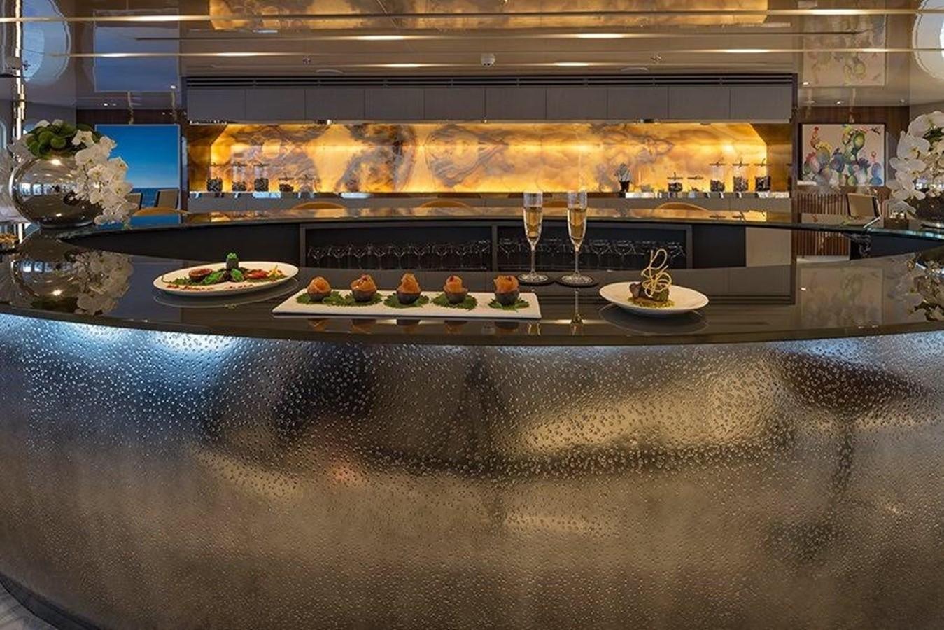 a counter with food and wine glasses aboard MARQUISE Yacht for Sale