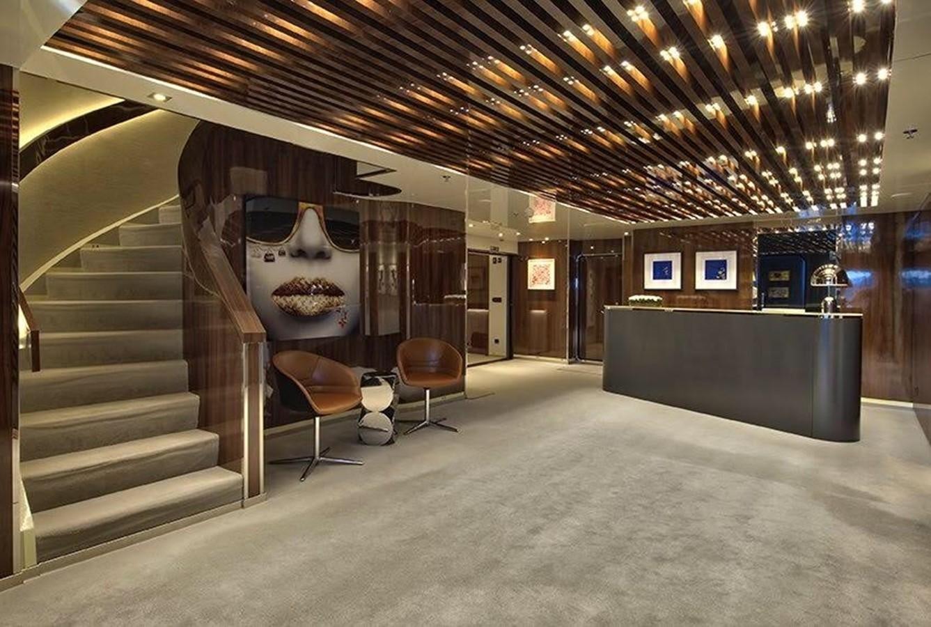 a room with a staircase and a chair aboard MARQUISE Yacht for Sale