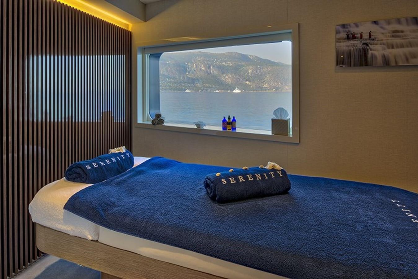 a bed with blue sheets aboard MARQUISE Yacht for Sale