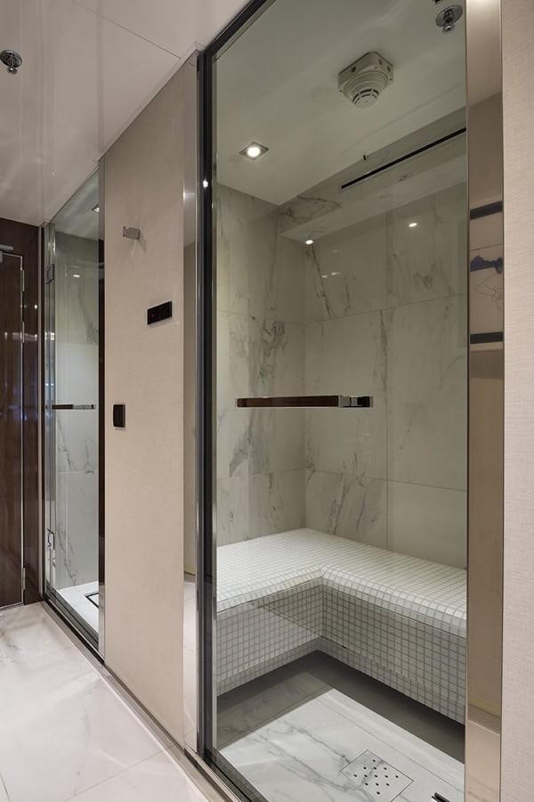 a bathroom with a glass shower aboard MARQUISE Yacht for Sale