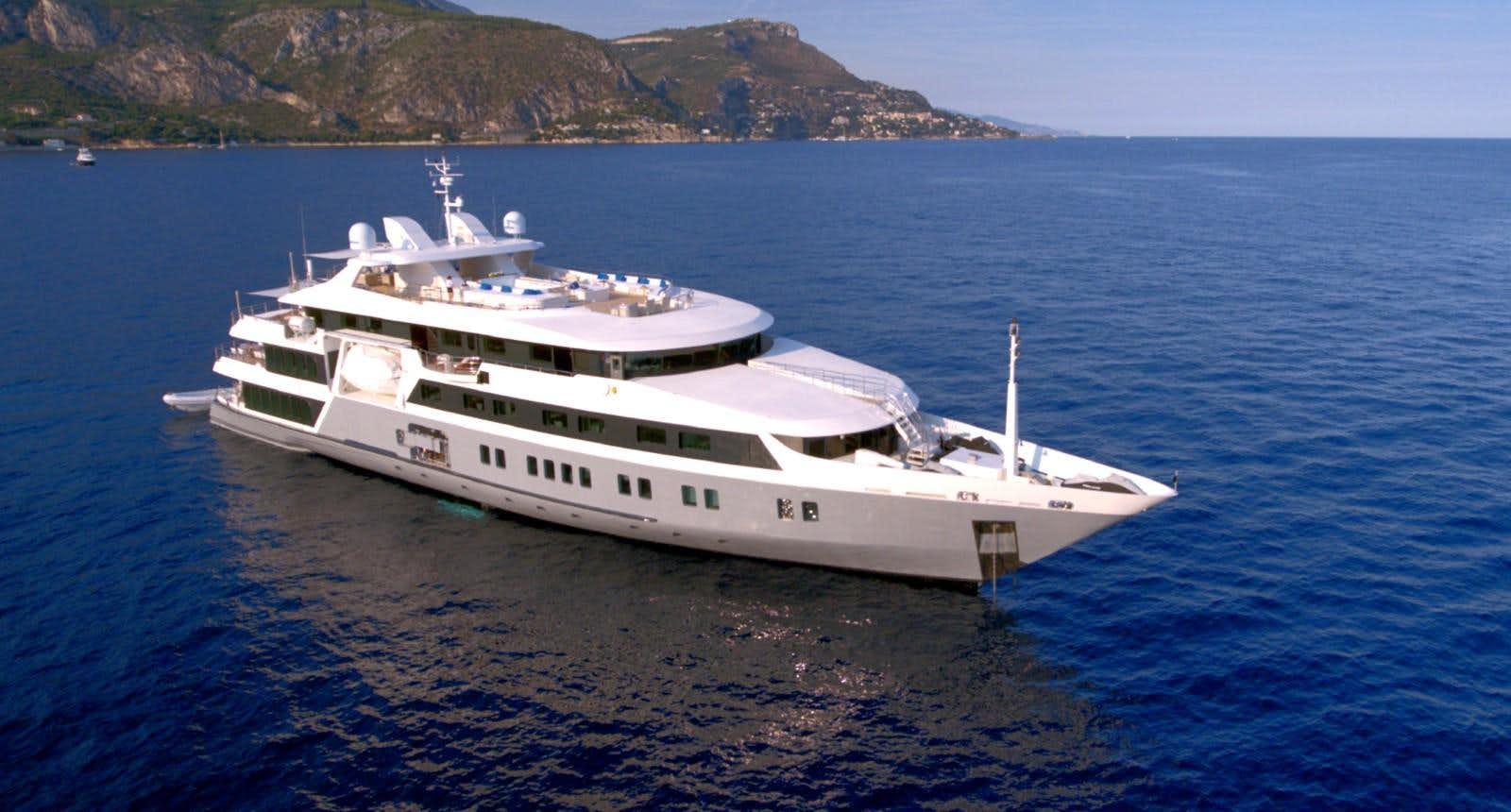 a large white ship in the water aboard SERENITY Yacht for Sale