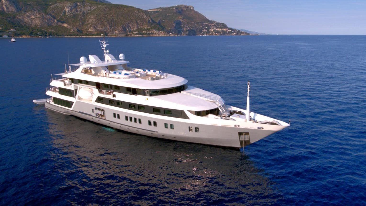 a large white ship in the water aboard SERENITY Yacht for Sale