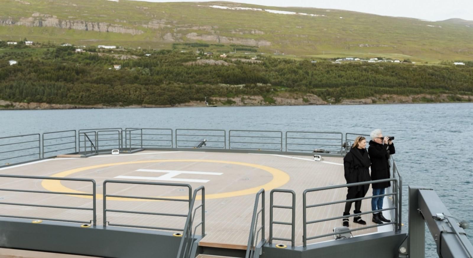 a couple of people on a boat aboard Q Yacht for Sale