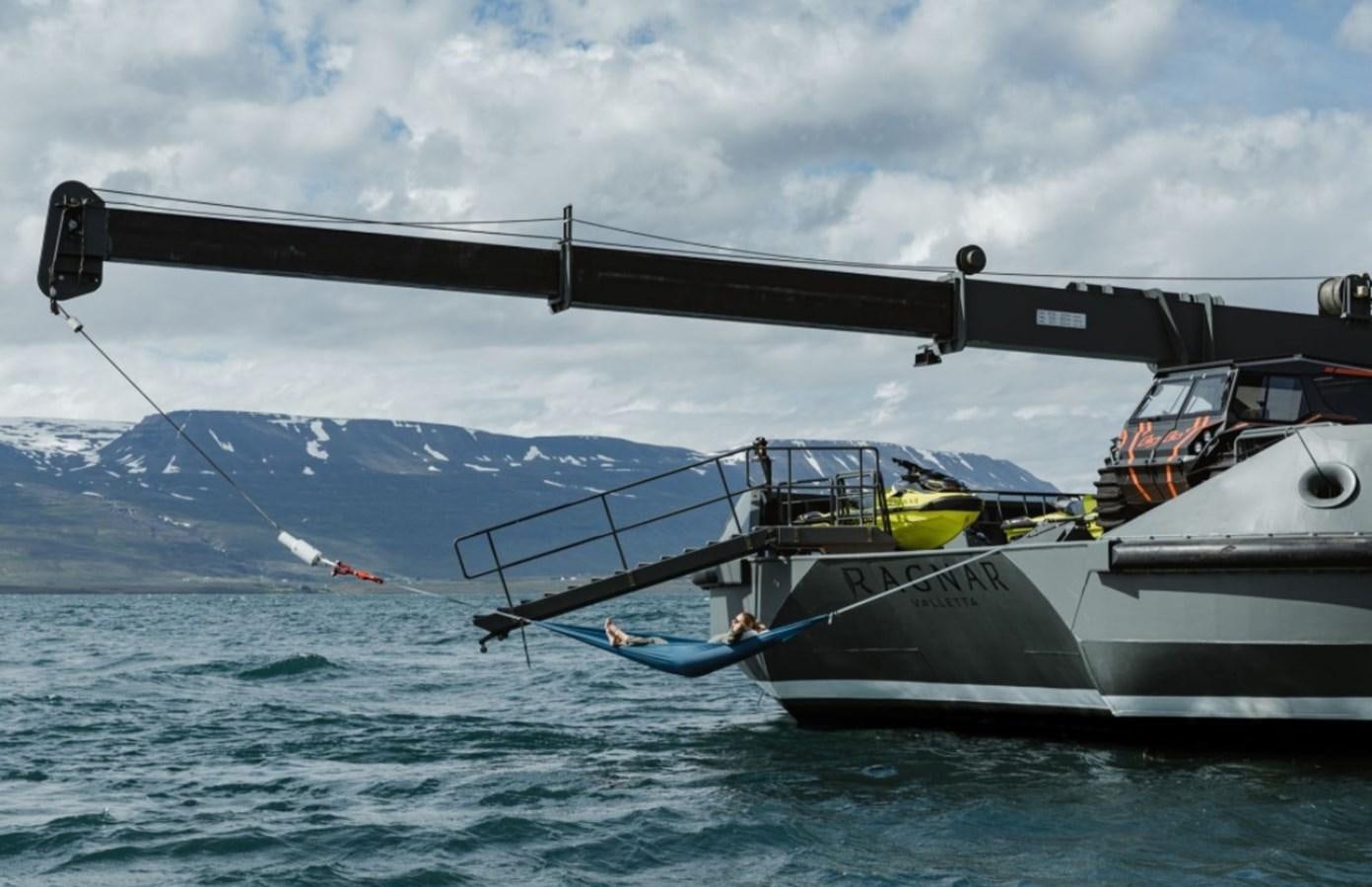 a helicopter flying over a boat aboard Q Yacht for Sale