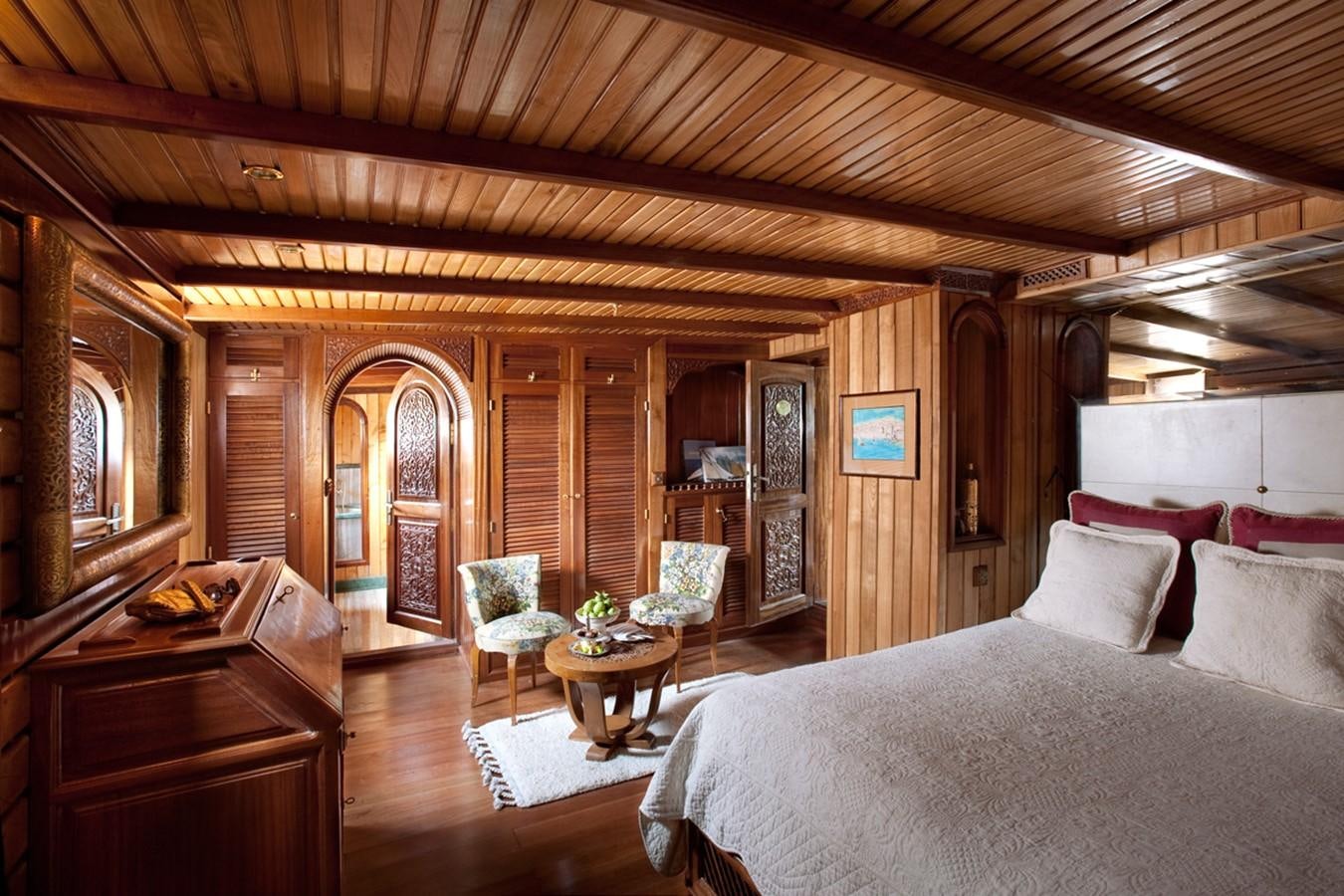 a bedroom with a bed and a table aboard NORTH SEA Yacht for Sale