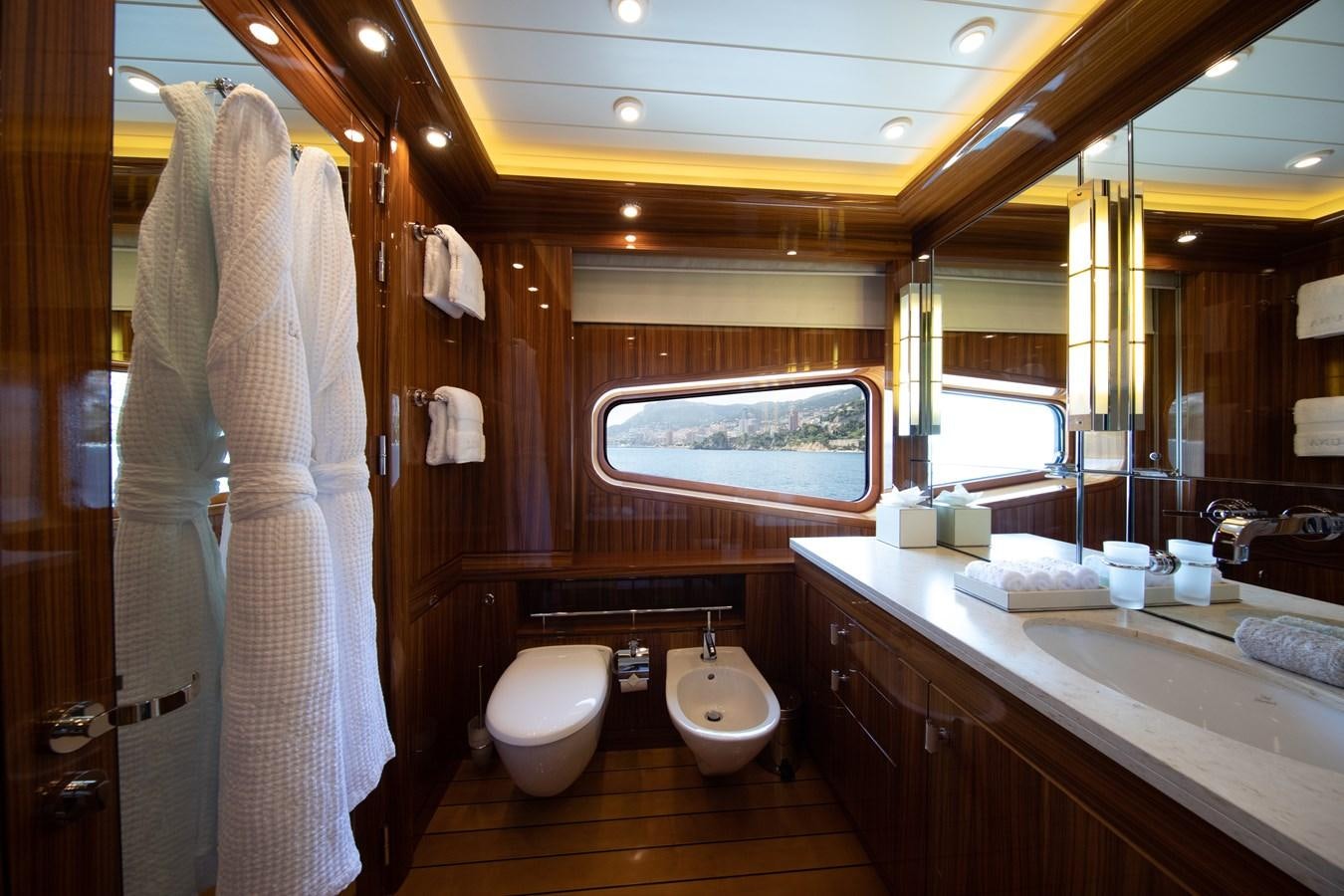a bathroom with a large mirror aboard AHS Yacht for Sale