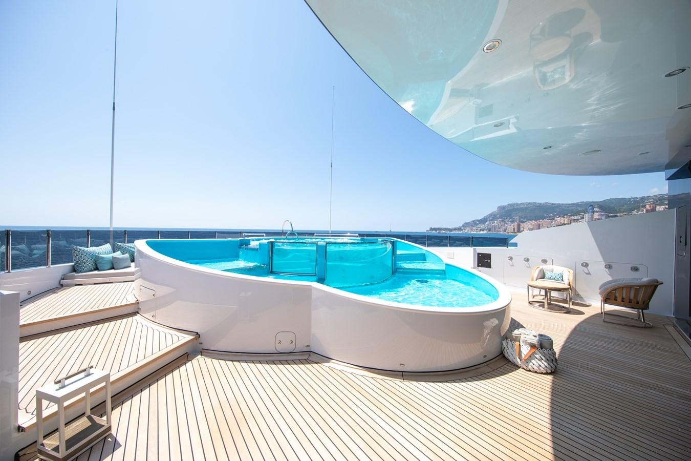 a large pool with a deck aboard AHS Yacht for Sale