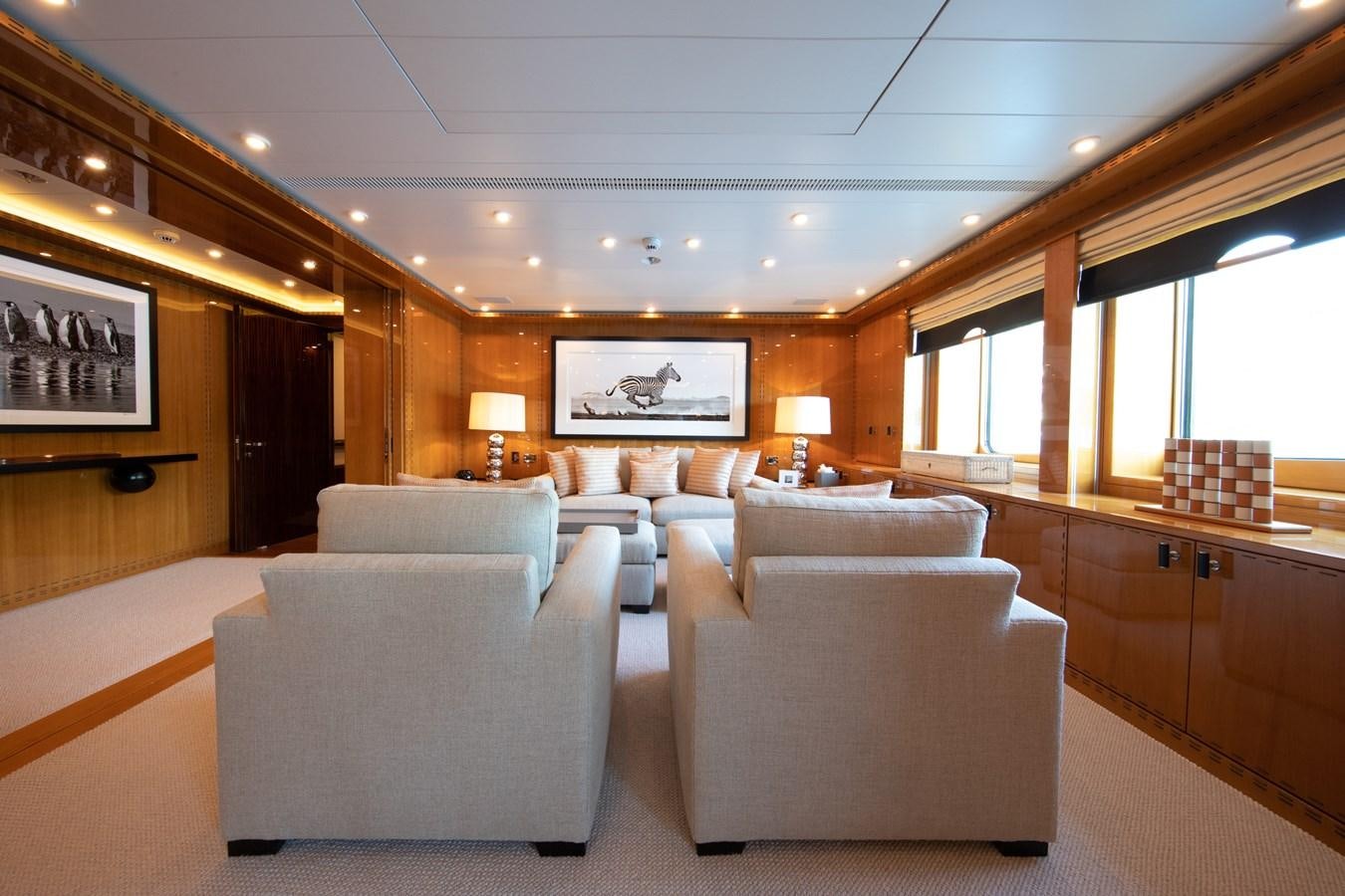 a large living room with a large window aboard AHS Yacht for Sale