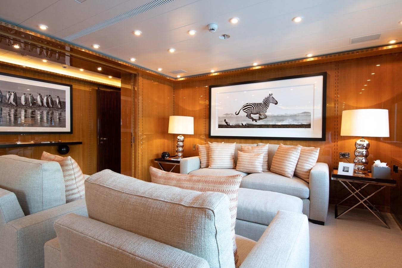 a living room with a large mirror aboard AHS Yacht for Sale