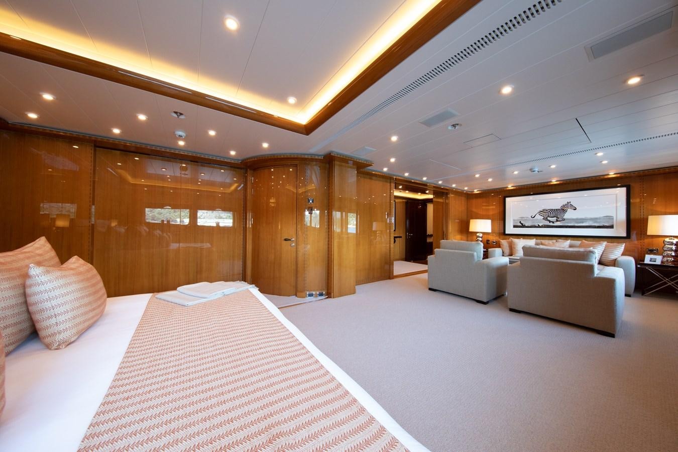 a large hotel room with a bed and a couch aboard AHS Yacht for Sale