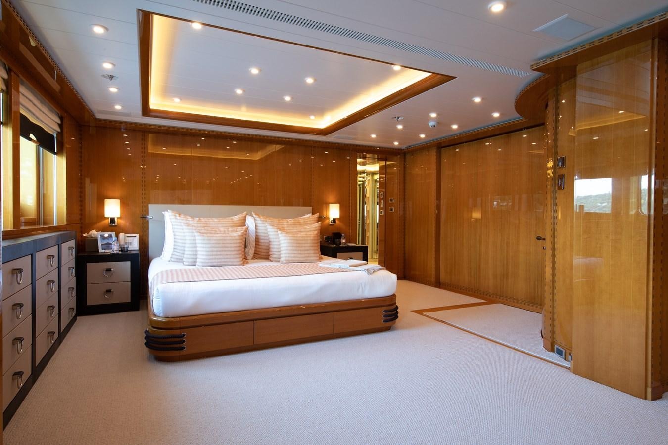 a large bedroom with a large bed aboard AHS Yacht for Sale