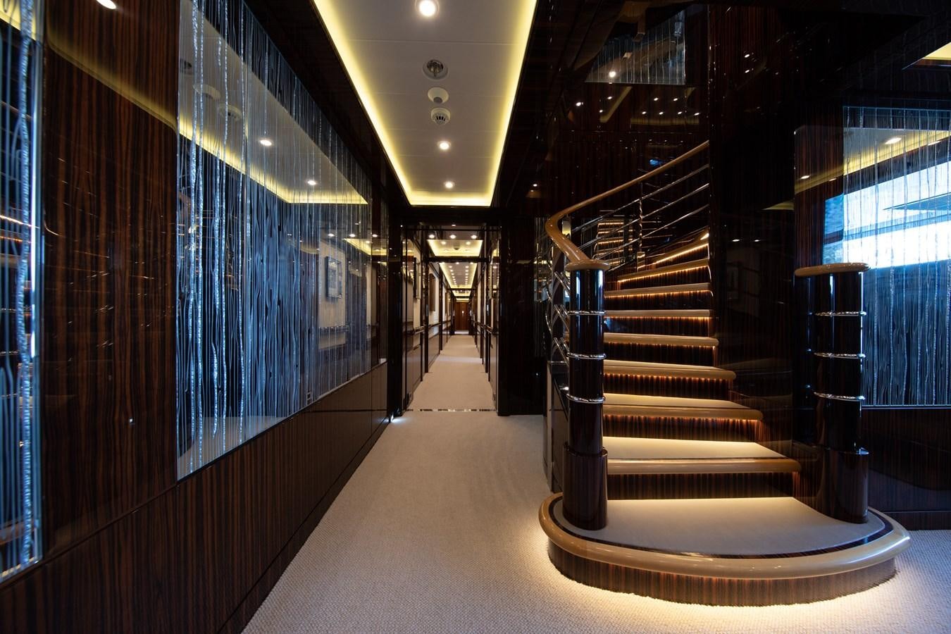 a long hallway with a set of stairs aboard AHS Yacht for Sale