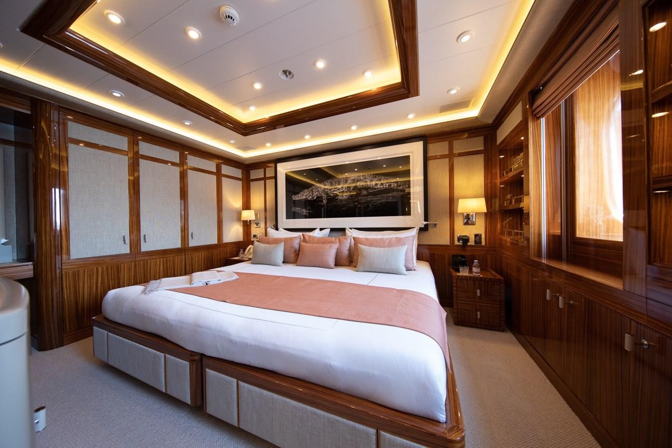 a large bedroom with a large bed aboard AHS Yacht for Sale