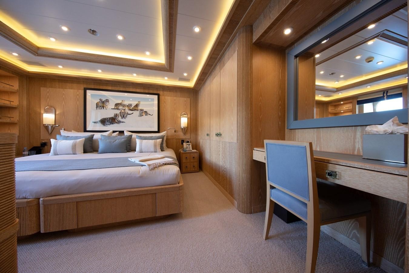 a room with a bed and a chair aboard AHS Yacht for Sale