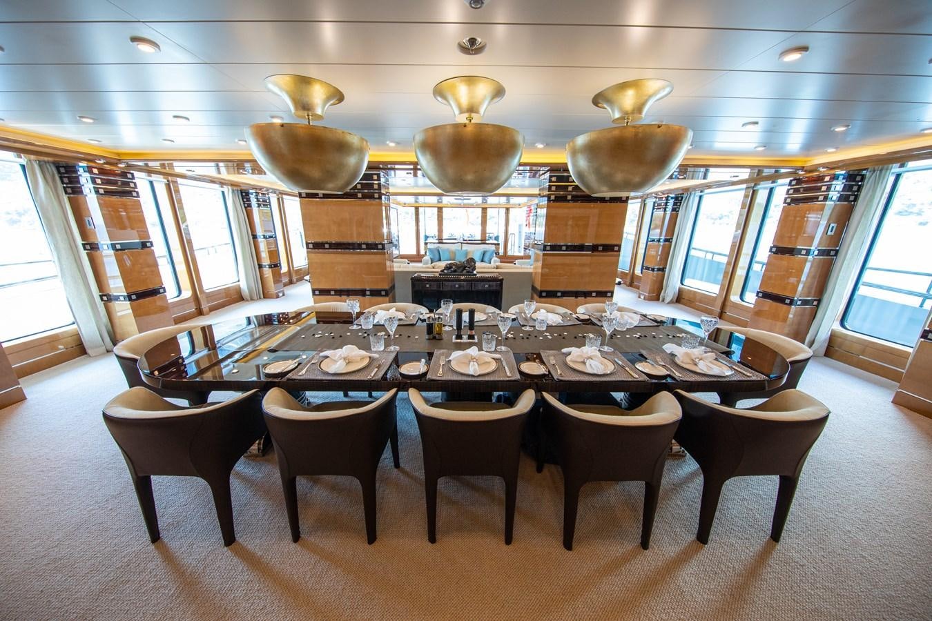 a dining room table with chairs aboard AHS Yacht for Sale