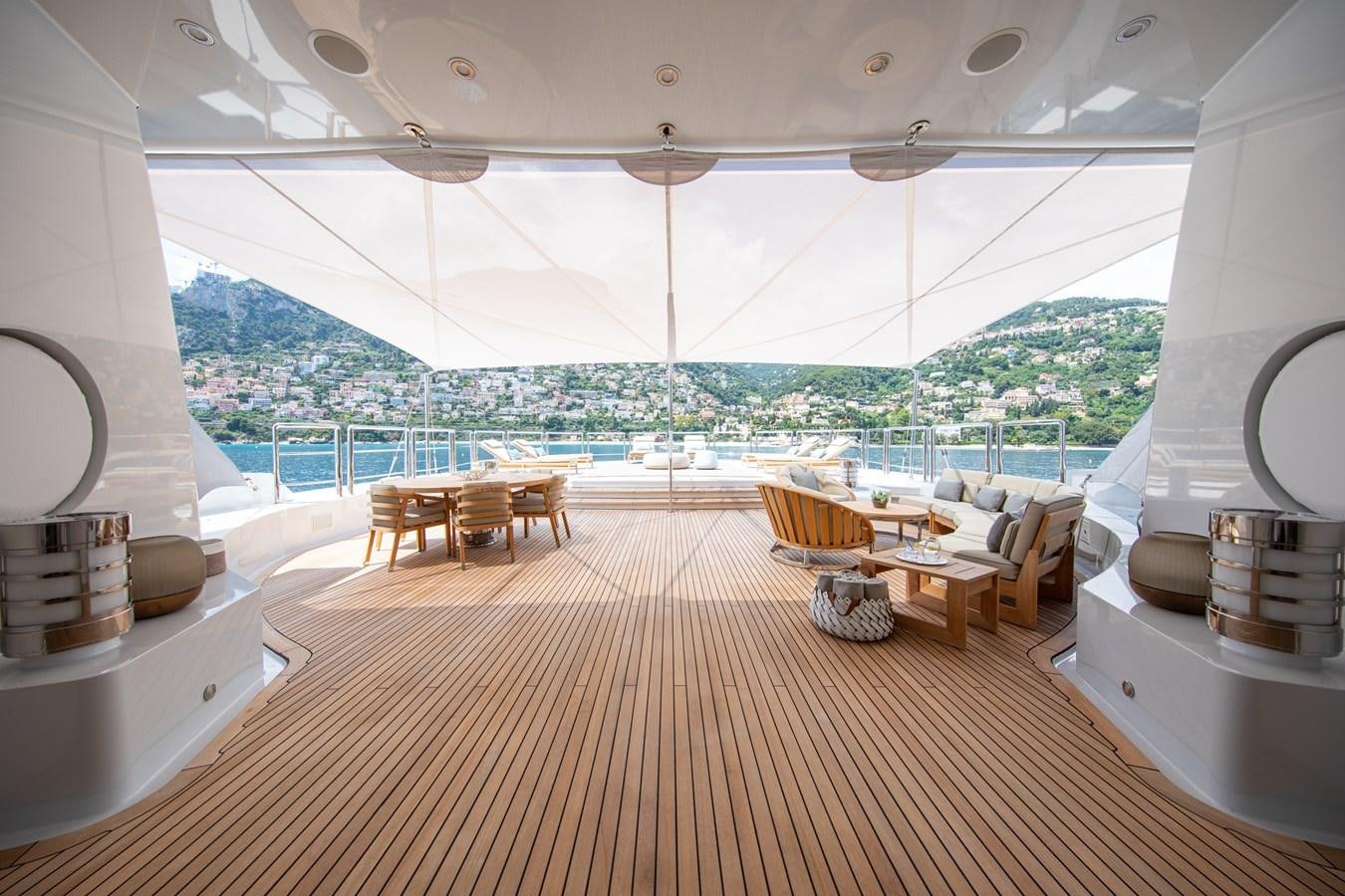 a room with a view of a city and a large body of water aboard AHS Yacht for Sale