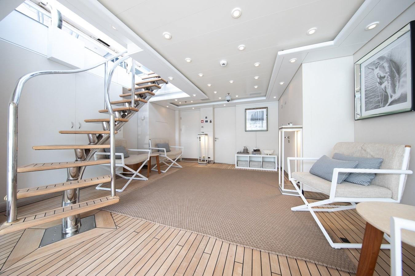 a room with a wood floor and white walls and a wood floor aboard AHS Yacht for Sale