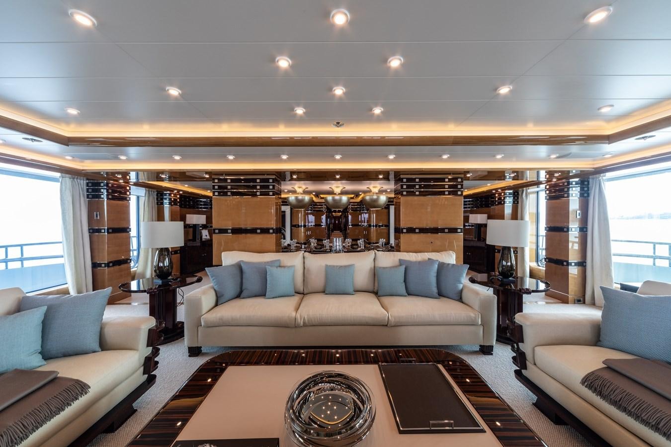 a living room with a couch and a table aboard AHS Yacht for Sale