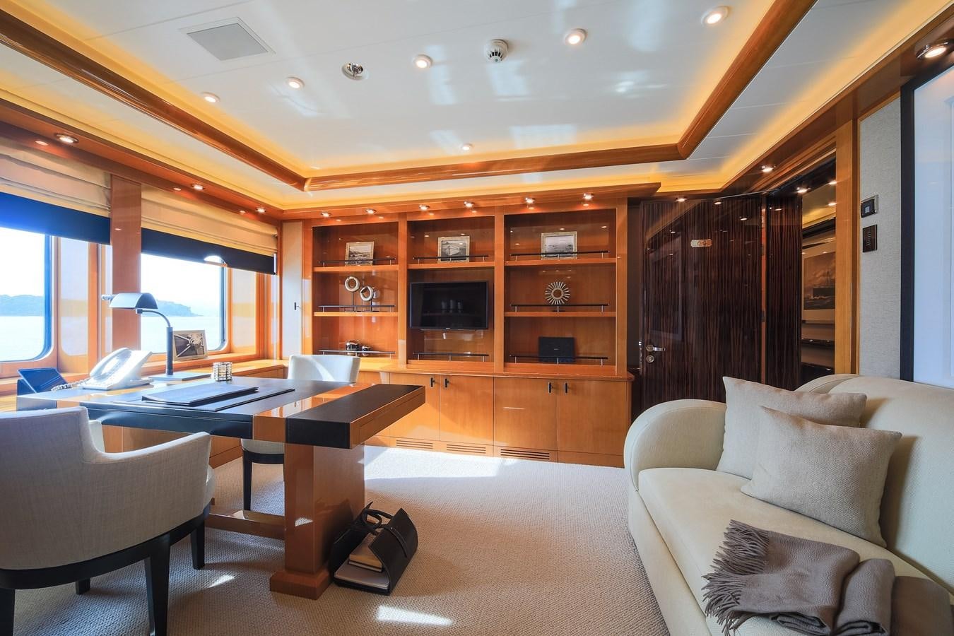 a living room with a couch and a tv aboard AHS Yacht for Sale