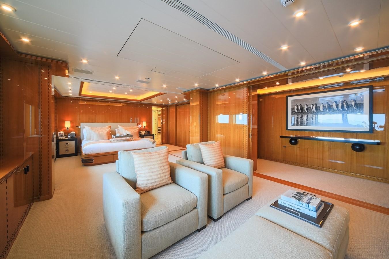 a living room with a large screen aboard AHS Yacht for Sale
