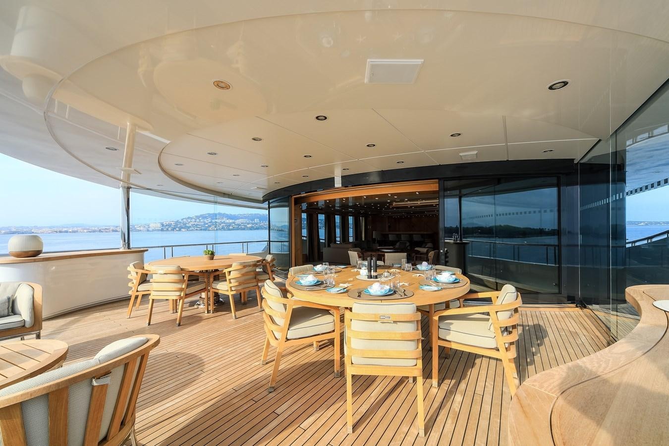 a room with a table and chairs aboard AHS Yacht for Sale
