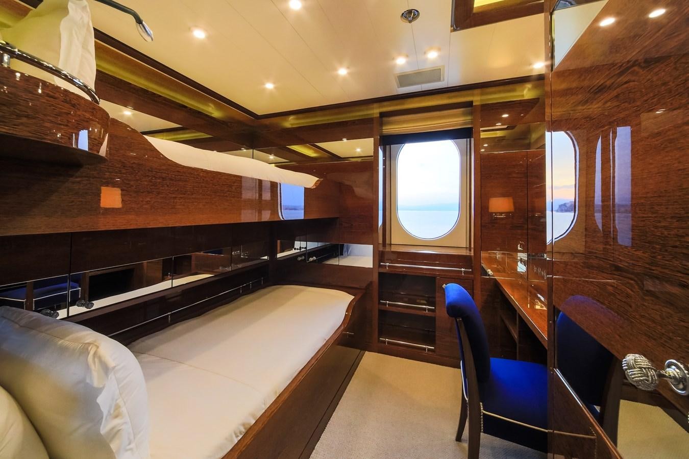 a room with a bed and a tv aboard AHS Yacht for Sale