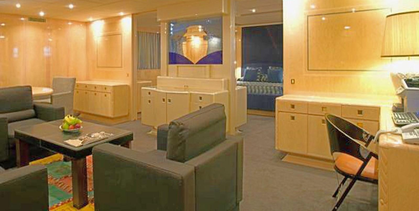 a room with a tv and a table aboard ADAMAS V Yacht for Sale