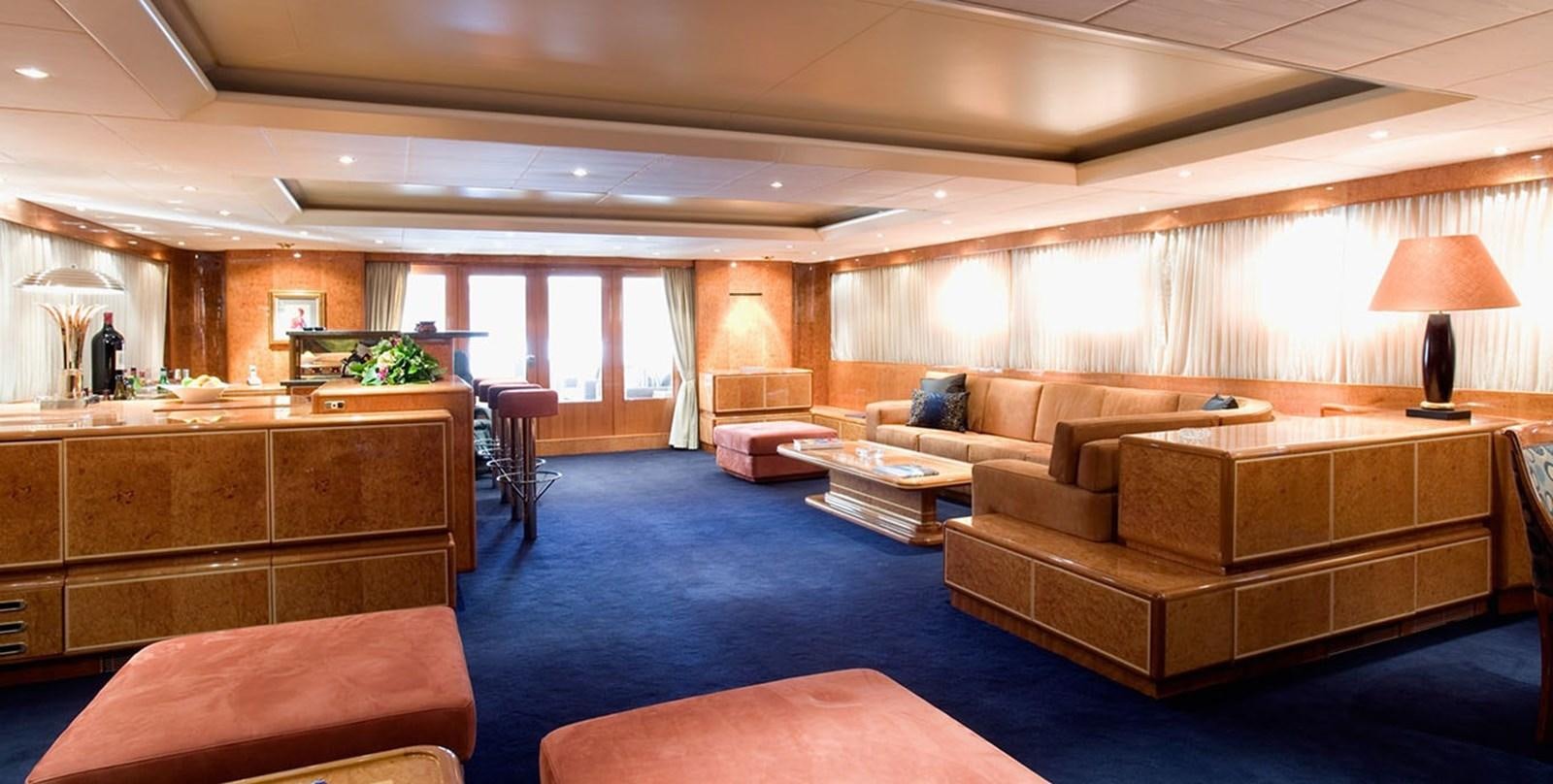 a living room with a couch and a table aboard ADAMAS V Yacht for Sale