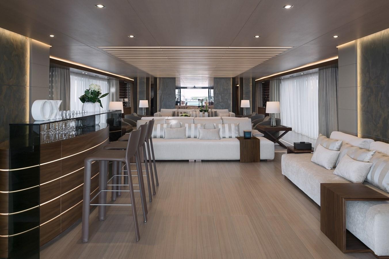 a large room with a bed and a table aboard UTOPIA IV Yacht for Sale