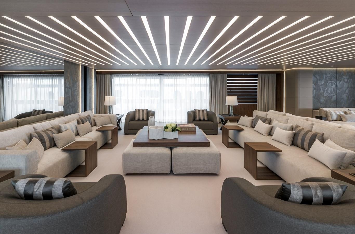a living room with a large window aboard UTOPIA IV Yacht for Sale