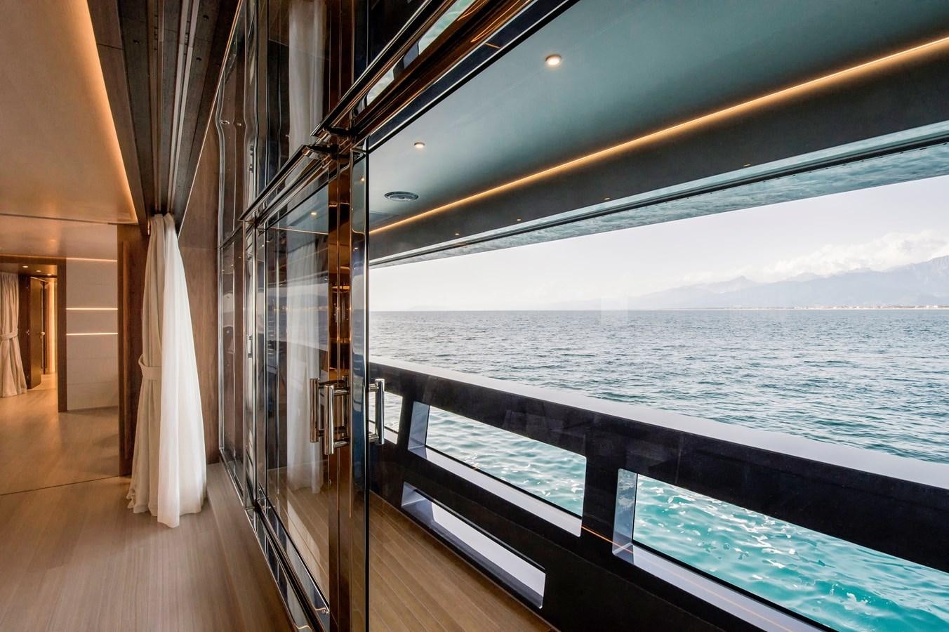 a balcony overlooking the ocean aboard UTOPIA IV Yacht for Sale