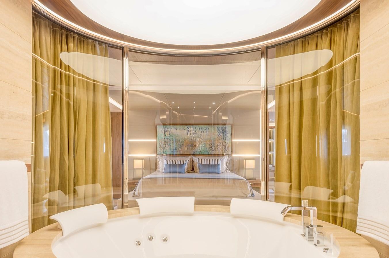 a large bathroom with a large mirror aboard UTOPIA IV Yacht for Sale